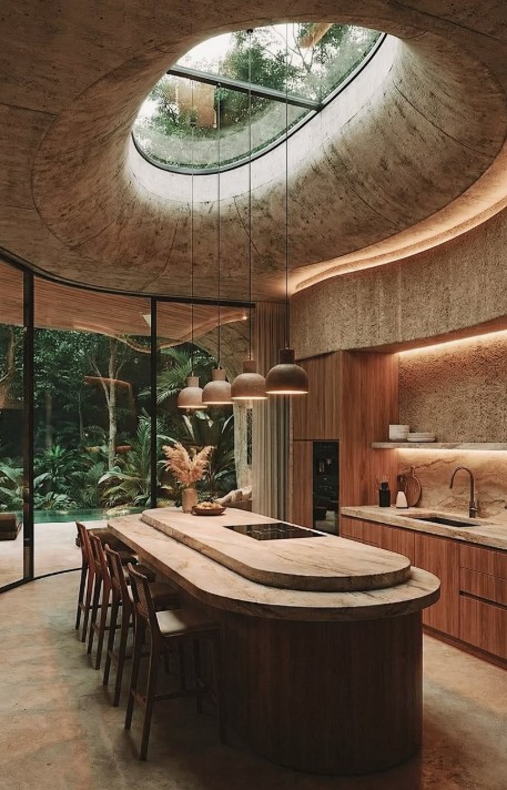 Kitchen with circular skylight and live-edge island
