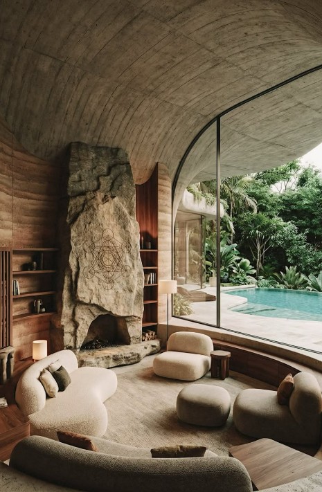 Double-height living room with sacred geometry feature wall